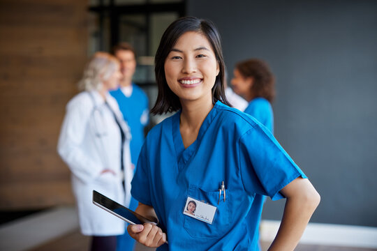 Portrait of smiling chinese nurse looking at camera