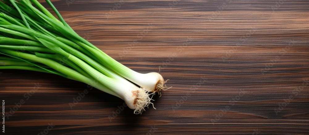 Poster fresh green onions arranged on a dark wooden table with ample negative space for text. vibrant green