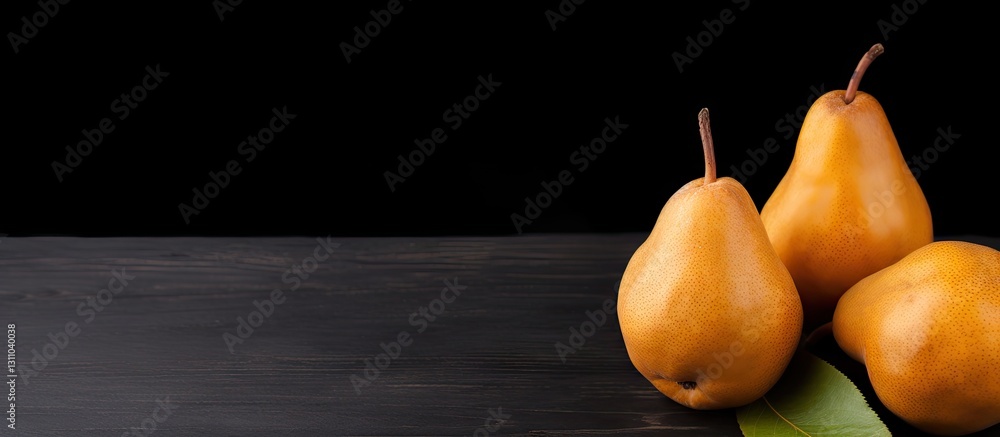 Poster Two ripe brown pears on a black wooden table with a green leaf, creating a minimalist and elegant composition, perfect for copy space.