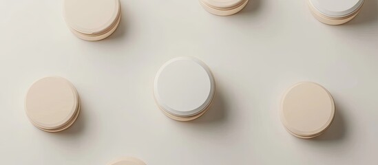 Modern beauty product packaging featuring a central white container with a beige cap surrounded by beige circular elements on a light background