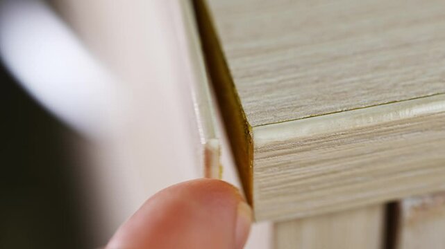 The veneer edge, thin natural wood, came off the furniture. wear and tear of old furniture.