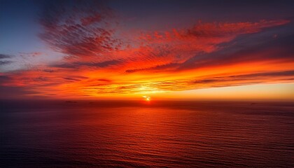 Obraz premium A striking gradient that transitions from deep orange to rich gold and fiery crimson red, capturing the intensity and warmth of a breathtaking sunset blaze. The colors evoke the fiery energy of dusk