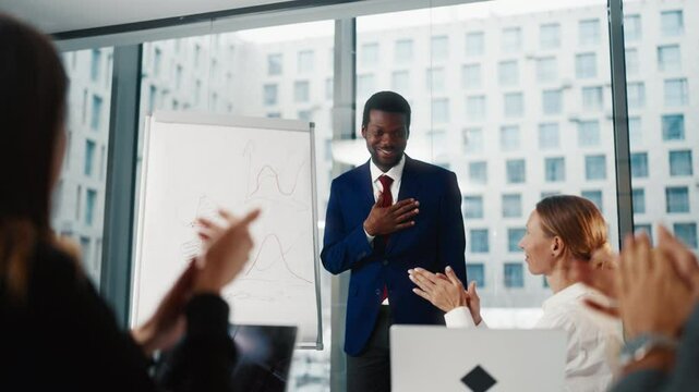 Startup presentation for investors, black man drawing sales diagram in office. Diverse people working together in international corporation, brainstorming and planning, top manager developing strategy