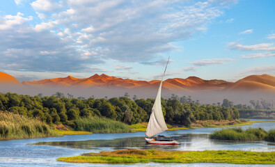 White sailing Felucca sailboats on River Nile, Aswan, Egypt