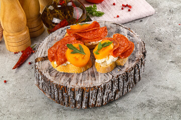 Bruschetta with sausage and tomato