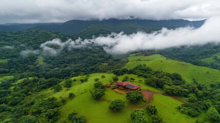 Obraz premium Lush Green Landscape with Dramatic Clouds and Scenic Mountains