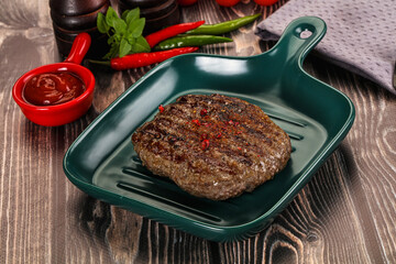 Grilled beef burger cutlet with sauce