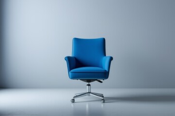 a close up of a blue chair in a white room