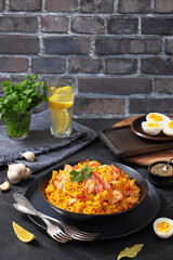 hot smoked salmon kedgeree in a black bowl
