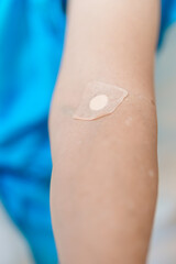 Elderly asian Patient Woman with medical patch plaster after blood test in hospital. Diagnose, illness, treatment, Insurance, Healthcare, medical Examination, Blood donation and World Blood Donor Day