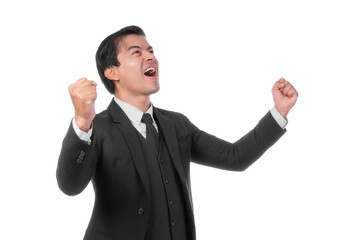 Excited and joyful young businessman wearing a formal black suit and tie, raising his fists in celebration of success achievement, showing happiness and triumph, isolated on a transparent background