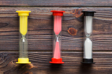 hourglass on the table, sand clock as time passing concept for business deadline, copy space