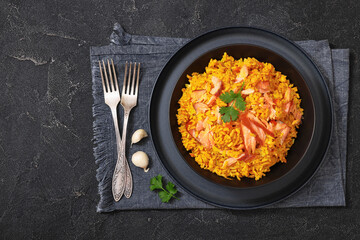 hot smoked salmon kedgeree in a black bowl