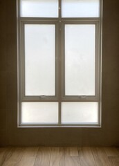 Closed  high frosted glass window set with wood floor and sunlight outside for lonely, misery, depress, mystery background