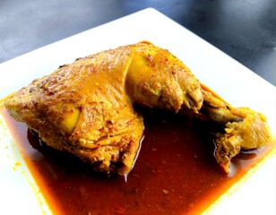 Steamed chicken leg in plate, in door Chiangmai Thailand.