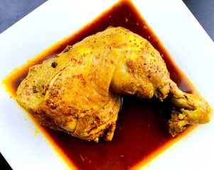 Steamed chicken leg in plate, in door Chiangmai Thailand.