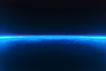 Fototapeta premium Abstract blue glowing light with a gradient from dark to bright on a black background, a planet Earth horizon line, and a space background for design and decoration in space themes,