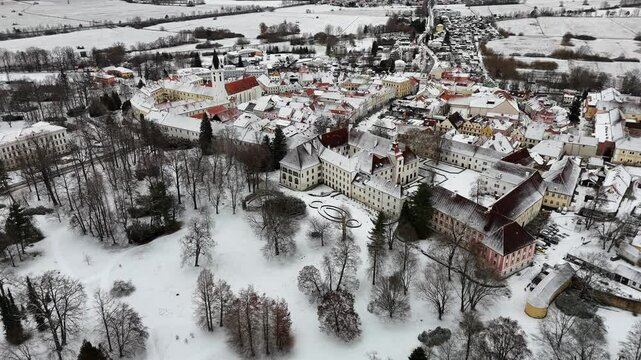 Chateau park and small historic town. Winter. Drone. Europe.