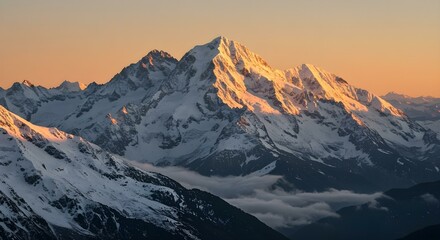 Obraz premium Golden Dawn Over Majestic Snow-Capped Peaks