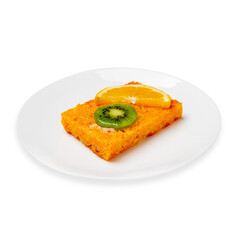 Carrot cake with orange and kiwi on a plate on a white background, isolant.