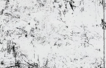 Abstract black and white grunge texture with scratches and stains, ideal for backgrounds and overlays.