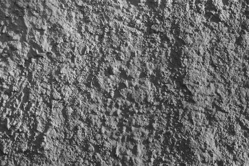 gray background, photo shows texture of plaster of concrete wall of building