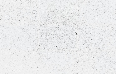 A minimalist black and white grunge texture with scattered speckles and noise for backgrounds and designs.