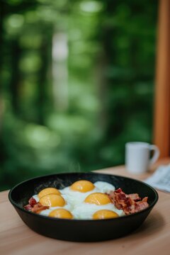 Delicious breakfast featuring sunny-side-up eggs and crispy baco