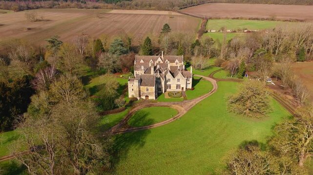 Exploring aerial view drone stately manor mansion royal buildings in the UK elegant lifestyle 