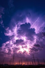 Lightning Strikes Purple Clouds Above Power Lines at Dusk