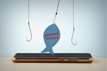 Mobile phone and fishing hooks with paper note in the shape of a fish with the written Password -...