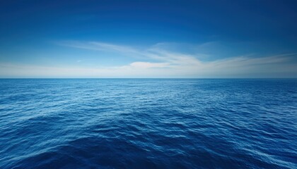 Obraz premium Tranquil seascape with soft ocean waters blending seamlessly into the horizon, creating a peaceful and meditative atmosphere with gentle waves and a calming color palette.