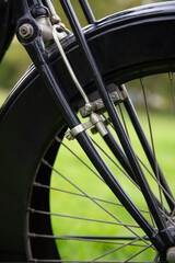 Close up of the engine of an old classic Triumph motorcycle in the garden