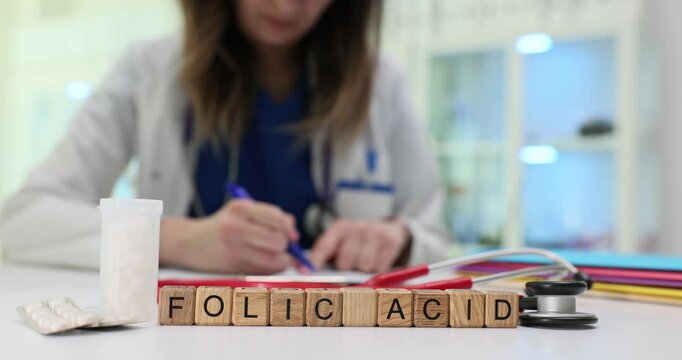 A healthcare professional notes on folic acid and emphasizes its crucial importance in the field of medicine