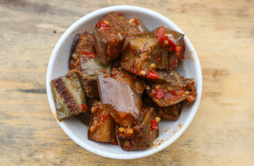 Terong balado or spicy eggplant, Serving in white plate. Indonesian food and cuisine
