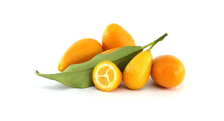 Fresh kumquats with leaves and a half kumquat showing the pulp