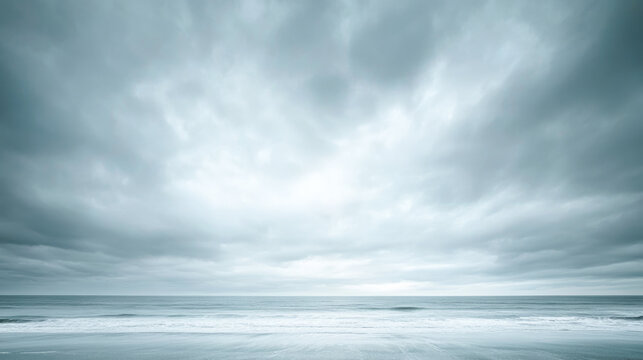 Dramatic cloudy sky over calm ocean horizon at dusk - Powered by Adobe