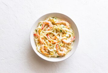 Linguine pasta in creamy garlic sauce with shrimps. Italian food.