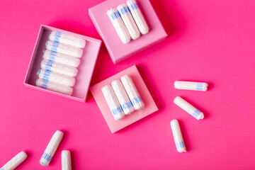 Many menstrual hygiene tampons from above on pink background in beautiful composition. Soft cotton...