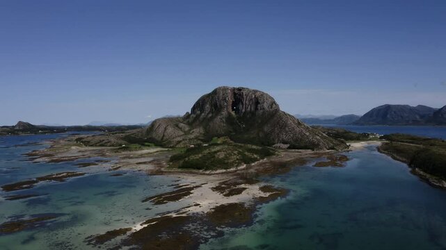 An aerial drone shot of Torghatten mountain, a mountain on Norway&rsquo;s Helgeland coast with a hole right through the middle. Br&oslash;nn&oslash;ysund, Norway