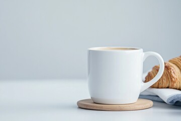 Warm coffee cup rests on wooden coaster beside freshly baked cro