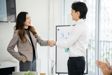 Fototapeta premium The sales team is having a marketing planning meeting in the conference room.