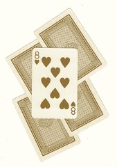 A montage of vintage playing card backs with one card revealed in sepia.
