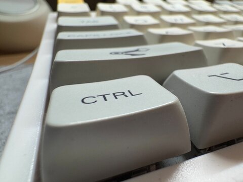 White ctrl key at close range on mechanical keyboard for programmer - Powered by Adobe