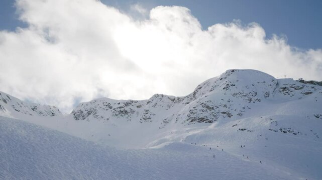 Whistler mountain peak, Canada, ski hill on a sunny day, ski resort. 4K 24FPS.