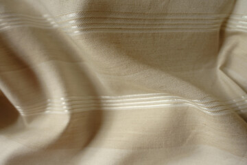 Rippled light beige striped cotton and polyester fabric