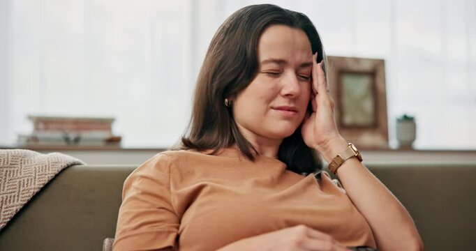 Phone, pregnant and woman with headache, pain and mental health of sick future mom in home. Stress, pregnancy and tired person with migraine, fatigue or massage temples with discomfort in living room