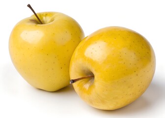 Two ripe, yellow apples with water droplets, isolated on white background.