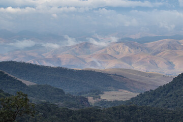 mountain landscape with clouds and forest