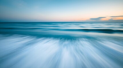 Blue sea and sky at dusk with long exposure motion blur.